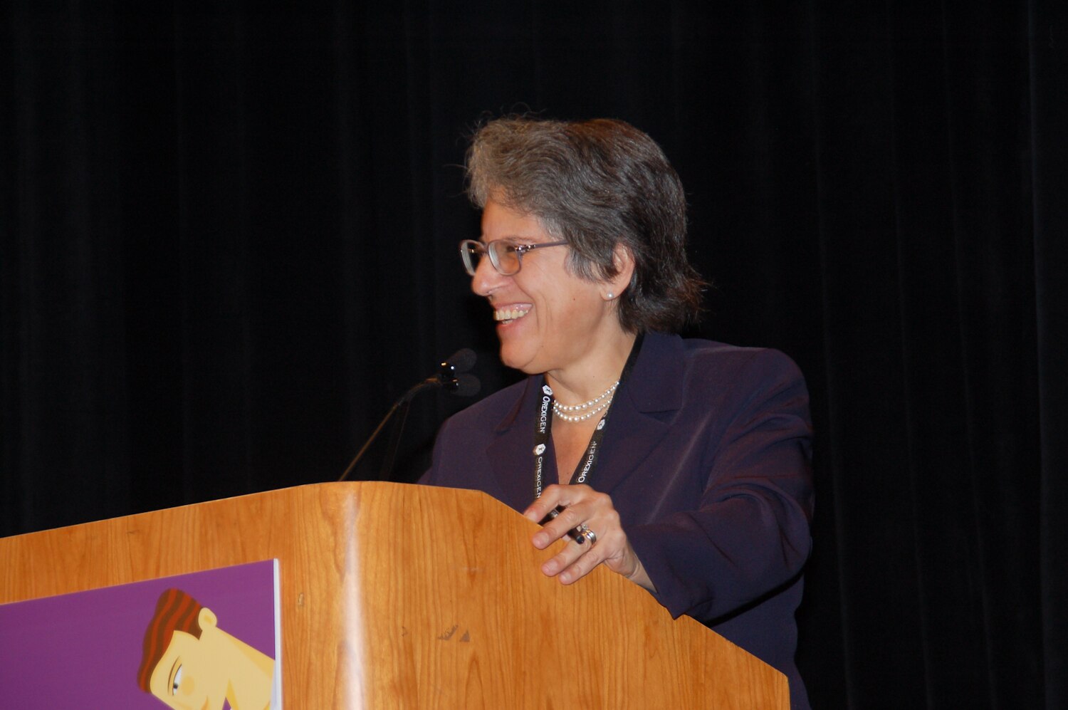 Dr. Susan Yanovski stands at podium