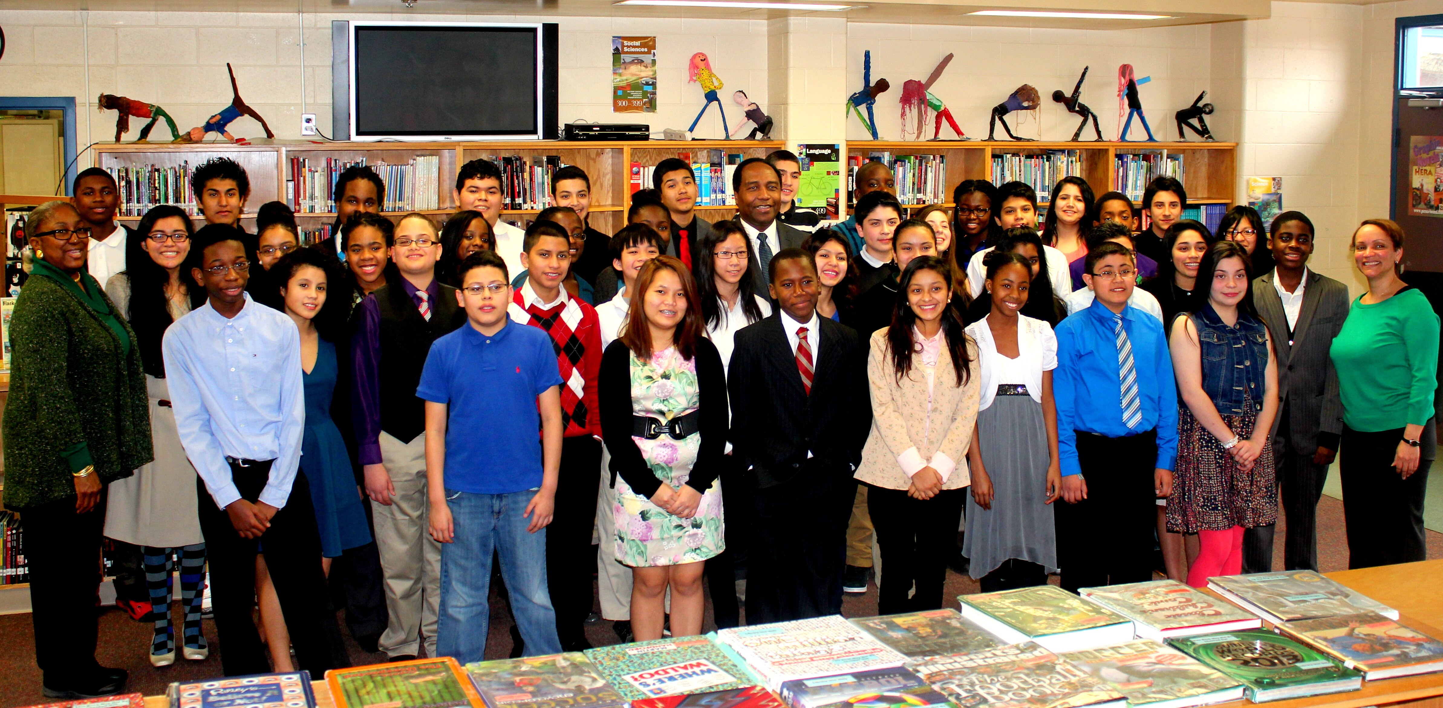 Photo of Dr. Griffin P. Rodgers with middle school students at Buck Lodge Middle School