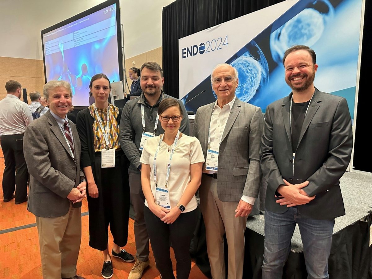  A group of people stand in front of a banner that reads: ENDO 2024.