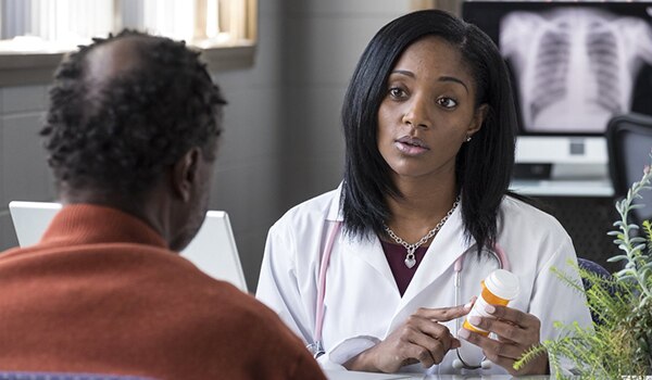 A doctor talking to a patient.