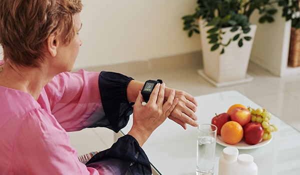 A woman checking her smart watch.