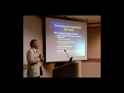 A man presenting at an NIH seminar