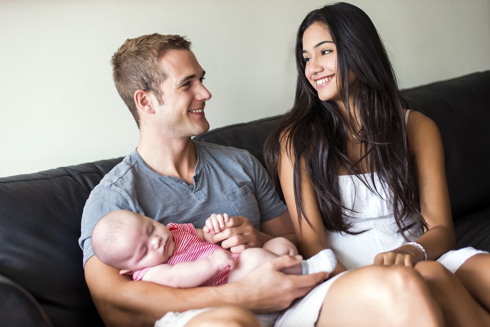 Young couple with a baby.