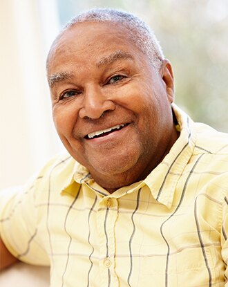 A smiling overweight older man