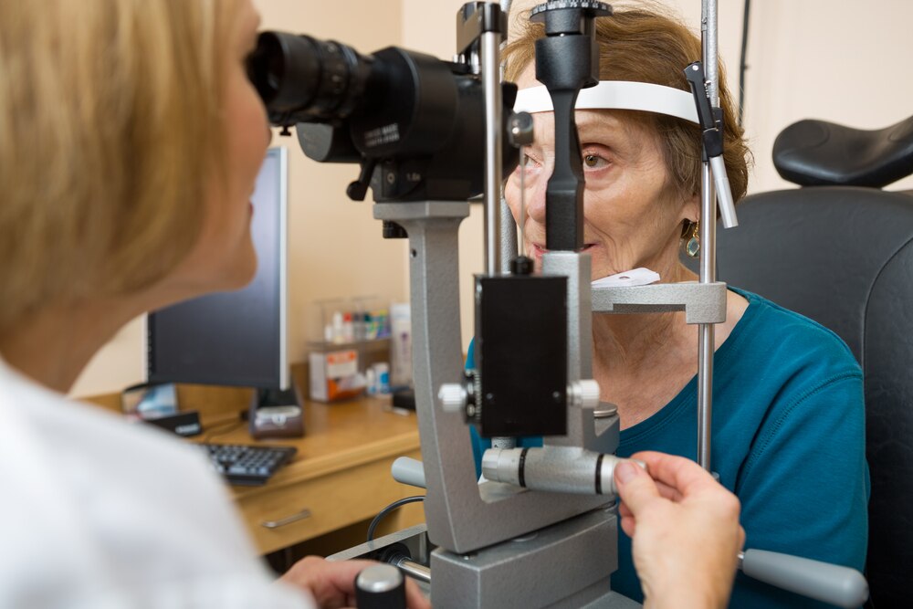 An older adult receiving an eye exam.