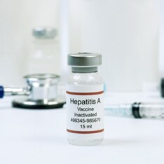 Hepatitis A vaccine vial and stethoscope.