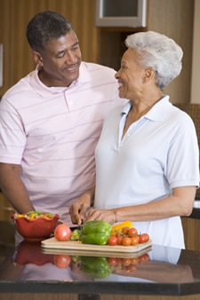 A photo of an older couple making a heart-healthy meal.
