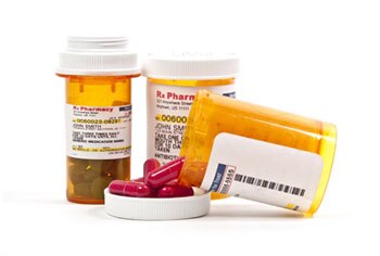 Labeled prescription medicine bottles.