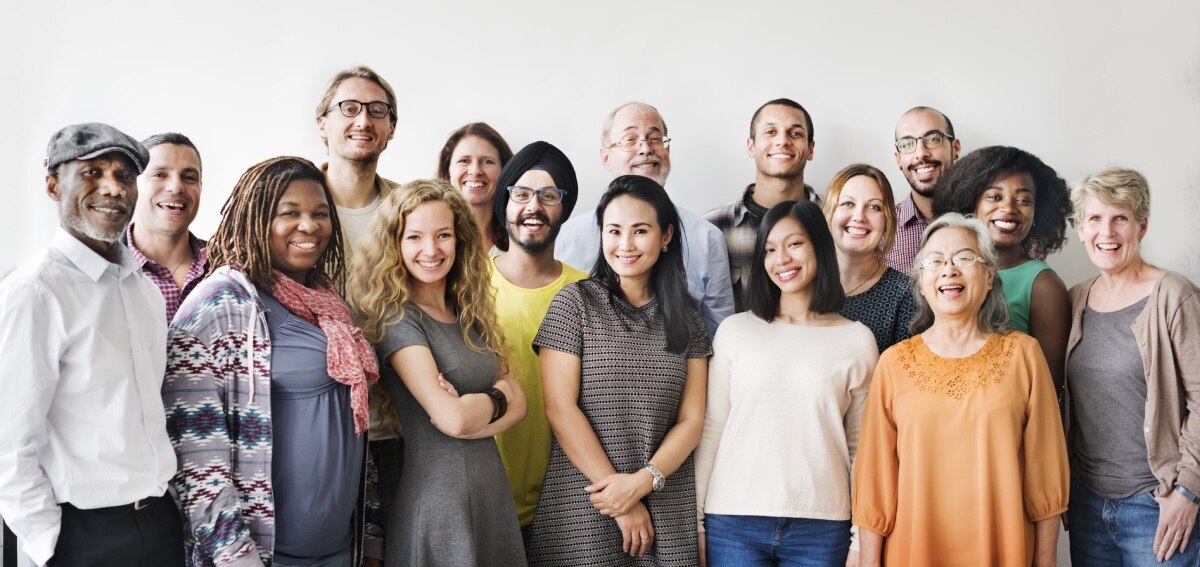 A large, multicultural group of men and women of all ages.