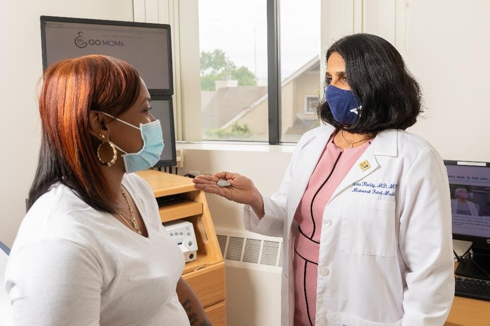 Doctor consulting patient wearing masks