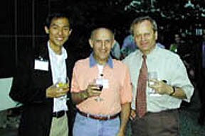 Photo of Alex Chang (Ph.D., 1998) and Jan Hirsh (Ph.D., 1977) with Paul