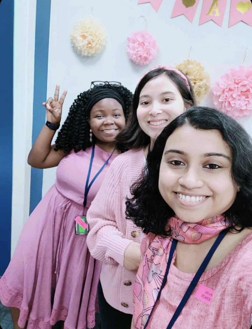 Kanyin, Nicole, and Moumita attending a lab meeting.